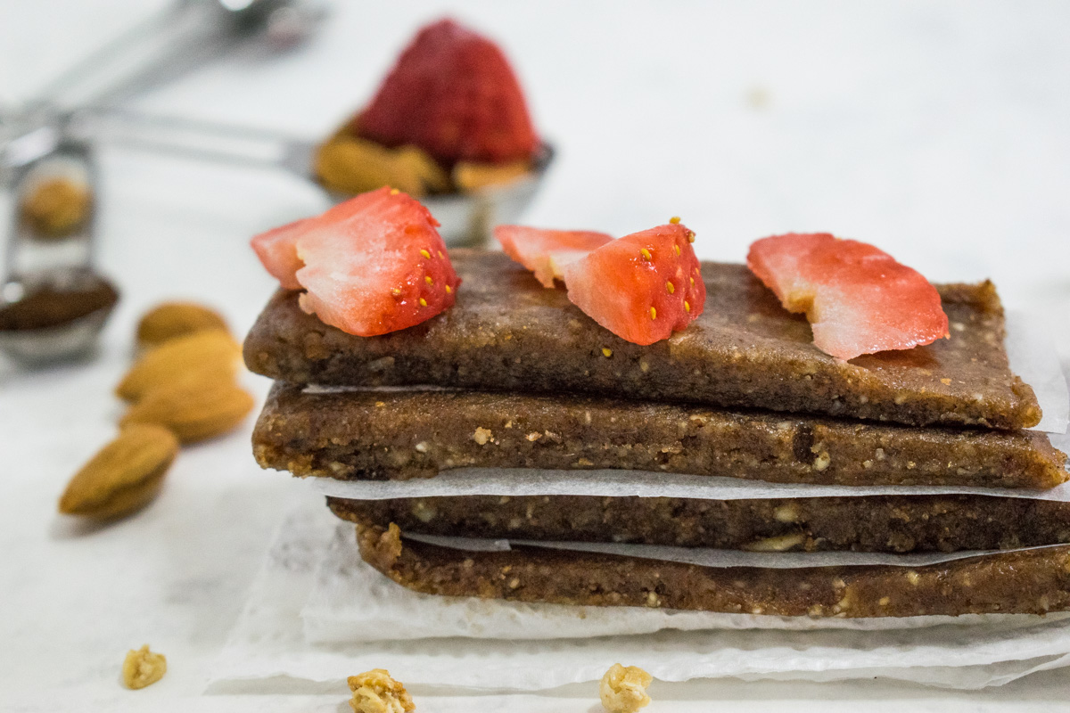 Raw date almond bars with strawberries and chocolate chunks